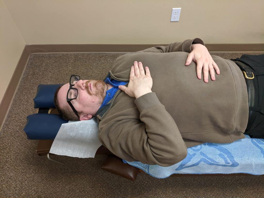 Demonstration of hand positioning for belly beathing